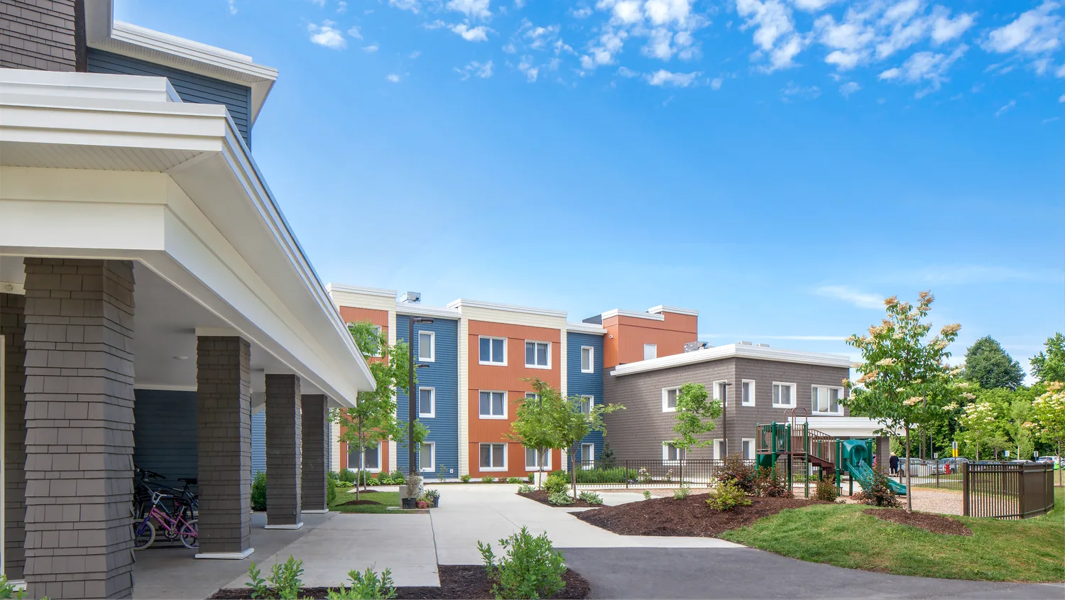 Village Homes affordable Passive House development in Brewer, Maine, with courtyard and playground.